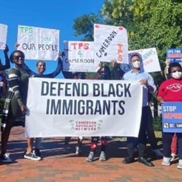 A group of protesters holding signs