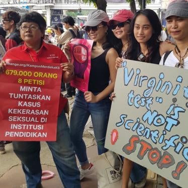 People protest holding signs