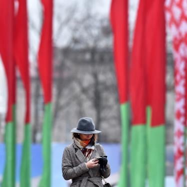 A woman looks at her mobile phone