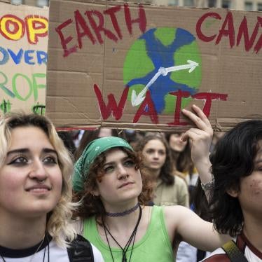People at a protest holding handmade signs