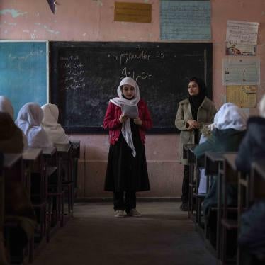 An Afghan girl reads in a classroom at Tajrobawai Girls High School, in Herat, Afghanistan, November 25, 2021.