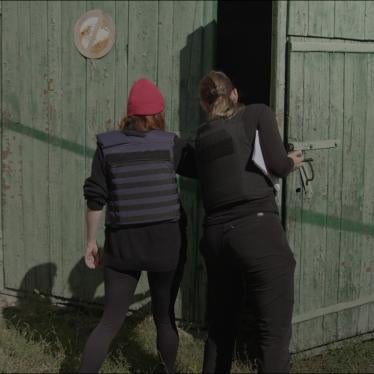 Investigators open doors of garage that was used by Russian forces as torture chamber