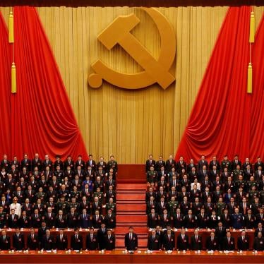 Chinese President Xi Jinping, front row center, stands with other officials