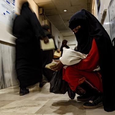 A mother holds her child diagnosed with cholera in a hospital in Deir el-Zour, Syria.