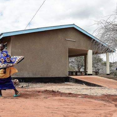 Maasai people walk past the health facility in Msomera village, Handeni, Tanzania.