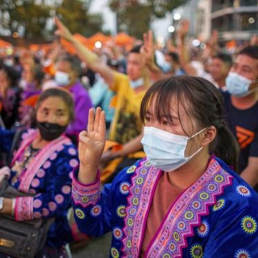 Ethnic minority women make three-finger salutes during pro-democracy demonstration in Chiang Mai, Thailand.