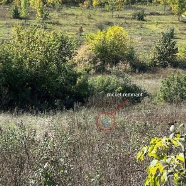 The carrier section of an 9M27K-series Uragan rocket lodged in the ground near a family’s home in Hlynske village, apparently fired from the west, where Ukrainian forces controlled territory while the area was under Russian occupation in 2022.  Each rocket delivers 30 9N210 or 9N235 submunitions.