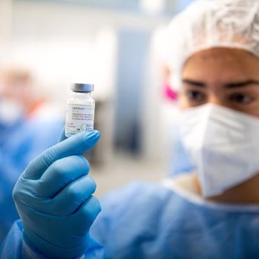 A staff member from the vaccination center at Brill holds a bottle of Moderna's Spikevax vaccine, Germany, September 13, 2022. 