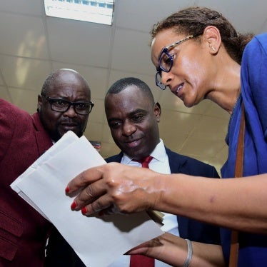 Pepe Onziema (L), Frank Mugisha (C),  from SMUG and UNAIDS representative Tseday Alemseged before the hearing of the petition challenging the Anti Homosexuality Act, Kampala,Uganda, December 13, 2023. 