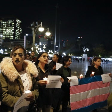  People carry the names of murdered transgendered women as dozens of transgender women and allies gather to commemorate murdered members of their community on Transgender Day of Remembrance in Mexico City.