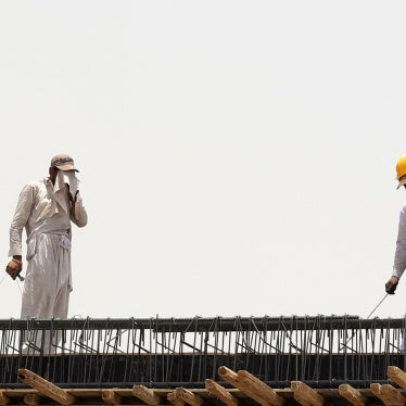 Migrant workers at a construction site amid scorching heat