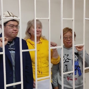 Kyrgyzstan Social Democrats party leader Temirlan Sultanbekov (L), chief campaigner Irina Karamushkina (C), and party member Roza Tyurksever after being detained in Bishkek on November 15, 2024. 