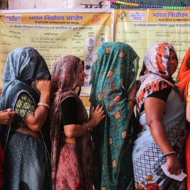 Voters wait at a polling station