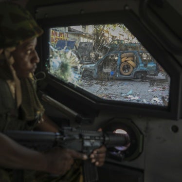 A Kenyan police officer, part of a UN-backed multinational force, patrols a street in Port-au-Prince, Haiti, December 5, 2024.