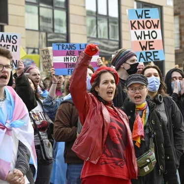 People from trans rights groups and community organizations take part in a rally following the Supreme Court ruling on the definition of a woman in equalities law.  
