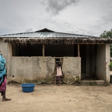 A mother walks with her daughters in the community of Saul, in the Metuge region of Cabo Delgado province, Mozambique, on March 26, 2024.