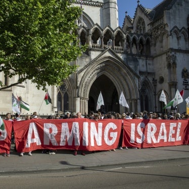 Activists hold a banner at a demonstration outside the Royal Courts of Justice in London, UK, May 13, 2025. 