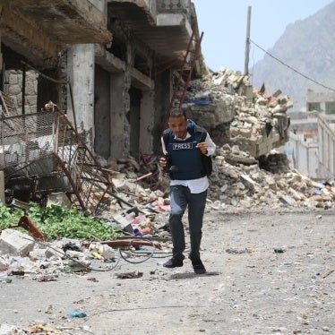 A journalist running down a city street