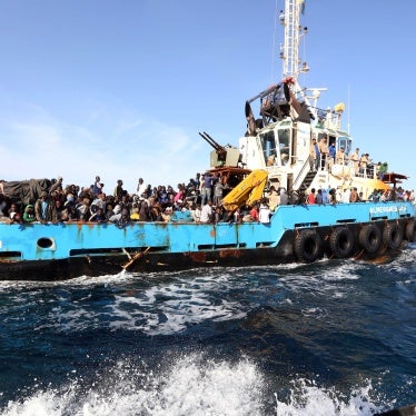 A Libyan coastguard boat carrying migrants arrive at the port in the city of Misrata on May 3, 2015, after the coastguard intercepted five boats carrying around 500 people trying to reach Europe.