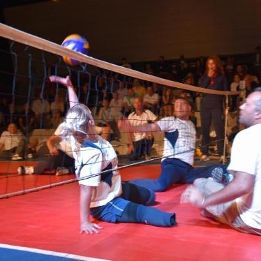 Cluster munition survivors who lost their legs play sitting volleyball one evening with participants of the First Review Conference of the Convention on Cluster Munitions in Dubrovnik, Croatia © 2015 Mark Hiznay/Human Rights Watch