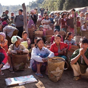 Displaced Kachin civilians living in temporary shelter in KIA-controlled territory in eastern Kachin State, wait for rations of rice and cooking oil, January 26, 2012. 