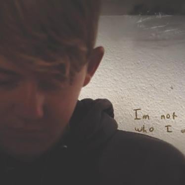 Josh Greer, a student who has been the target of bullying and discrimination in school, writes in his journal in his bedroom in Cache Country, UT, October 2016.