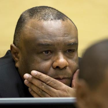 Former Congo vice-president Jean-Pierre Bemba looks up when sitting in the courtroom of the International Criminal Court to stand trial in The Hague, Netherlands, September 29, 2015.