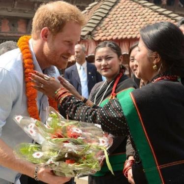 Nepalese girls welcome Britain's Prince Harry as he visits heritage sites in Patan Durbar Square in the outskirts of Kathmandu, March 20, 2016. 