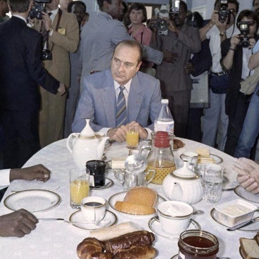 French president Francois Mitterrand (Right) and French Prime minister Jacques Chirac (Center) breakfast with Chadian President Hissene Habre (Left) during the 13th annual Franco-African summit meeting, on November 14, 1986 in Lome, Togo. © 1986 Daniel Ja