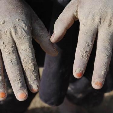 Helal, 10, works as a brick maker at a brick kiln outside Kabul. He told Human Rights Watch that the brick mold is heavy and his hands hurt working with wet clay. Helal doesn’t go to school because he has to work. 
