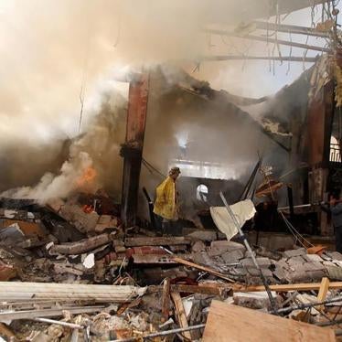 Firefighters try to extinguish a fire at the community hall in Sanaa where Saudi-led coalition warplanes attacked a funeral on October 8, 2016. 