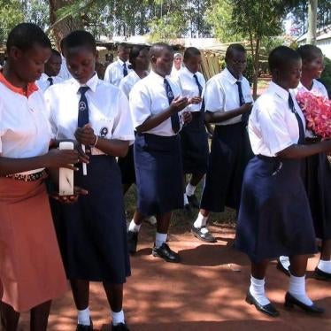 Former abducted Ugandan girls from St. Mary's College in Aboke who returned from captivity by Lord's Resistance Army (LRA) rebels walk with lit candles during a ceremony October 10, 2005 to commemorate the abduction day.
