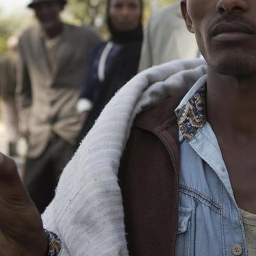 Mersen Chala holds a photo of his brother Dinka, who was killed by Ethiopian security forces a day earlier, in Yubdo village, Oromia region, about 100 kilometers from Addis Ababa, December 2015.