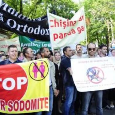 ©2016 Maxim Andreev for GENDERDOC-M. Demonstrators protest in opposition to an LGBT pride march held in Moldova in May 2016.