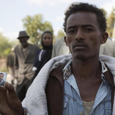 Mersen Chala holds a photo of his brother Dinka, who was killed by Ethiopian security forces a day earlier, in Yubdo village, Oromia region, about 100 kilometers from Addis Ababa, December 2015.