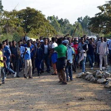 Ethnic Oromo march on a road in Ethiopia after security forces fatally shot protesters in Wolenkomi, some 60 kilometers west of Addis Ababa, December 15, 2015. 
