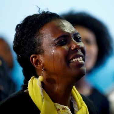 A woman cries as she attends a prayer session at Biftu Bole Lutheran Church during a prayer and candle ceremony for those who died in the town of Bishoftu during Ireecha, the thanksgiving festival for the Oromo people, Addis Ababa, Ethiopia, October 9, 20