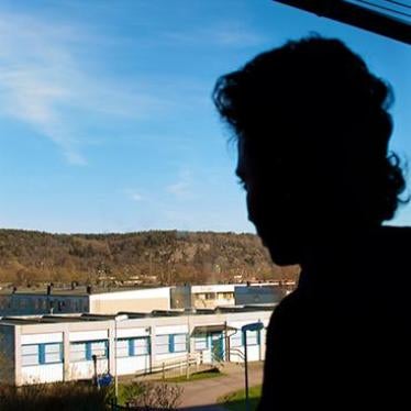 Tekle S., a 16-year-old Eritrean boy, looking out a window in his group home in Gothenburg, Sweden. 