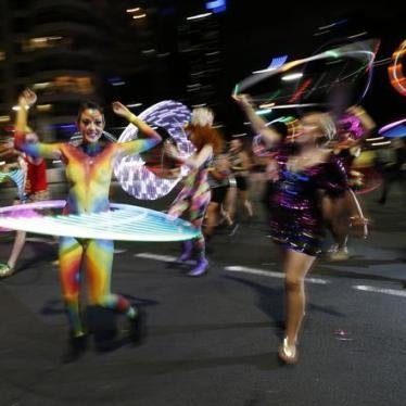Participants dance with hula hoops during the 2014 Sydney Gay and Lesbian Mardi Gras parade, Australia, March 1, 2014.