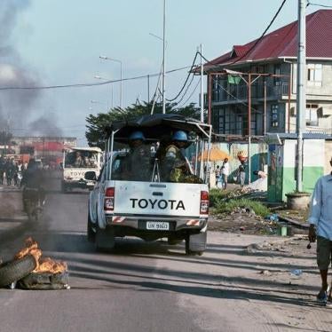 Peacekeepers serving in the UN peacekeeping mission in Congo (MONUSCO) drive past burning tyres as they patrol during protests against the failed implementation of the New Year’s Eve agreement, in Kinshasa, Democratic Republic of Congo, April 10, 2017.