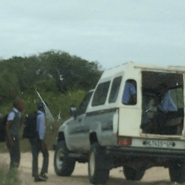 School children waiting to board their school transportation.