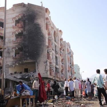 People gather at the site of a car bomb attack outside the Finance Ministry offices in the southern port city of Aden, Yemen November 29, 2017. 