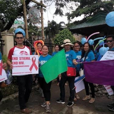 New UNAIDS country director Dr. Louie Ocampo (in red and white shirt) joins HIV advocates in the Philippines.