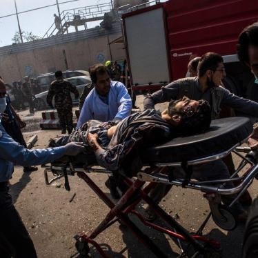 Medical workers transport an injured man on a stretcher to an ambulance near the site of a truck bomb in Kabul, May 31, 2017. 