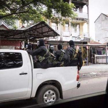 Armed members of the security forces wear black and white skeleton masks, apparently to intimidate protesters, in Kinshasa, January 21, 2018.
