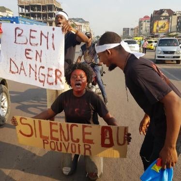 Congolese human rights activists hold a peaceful protest in Kinshasa, demanding an end to the killings in Beni, in eastern Democratic Republic of Congo, with signs reading “Beni in Danger” and “The Silence of those in Power,” on September 28, 2018.