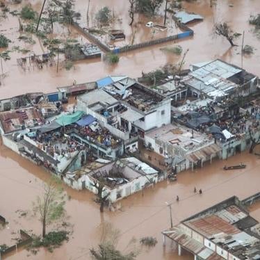 Residents of Buzi District, in Sofala province, Mozambique, wait on rooftops for rescue teams after Cyclone Idai, March 19, 2019.
