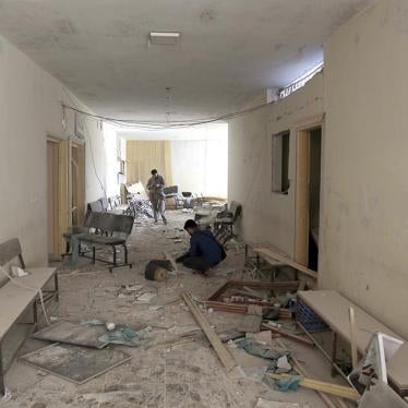 Syrians inspect the wreckage at a site after Syrian government airstrikes targeted a civilian hospital in the town of Hass, Southern rural Idlib, Syria, September 8, 2018.
