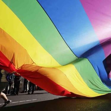 A rainbow flag is carried during a parade as a part of the Seoul Queer Culture Festival in Seoul, South Korea, Saturday, July 14, 2018. © 2018 AP Photo/Lee Jin-man