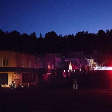 A car drives through a darkened Montclair Village as Pacific Gas & Electric power shutdowns continue in Oakland, California, October 10, 2019.